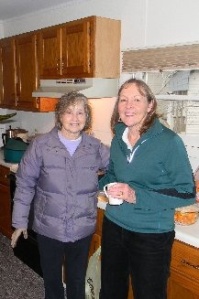 Billie Middaugh and Sue Lockett enjoy some hot apple cider